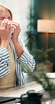 Business, night and woman with sneeze, tissue and sick with allergies, health risk and cold. Evening, person and employee in workplace, virus and flu with medical sinusitis illness and blowing nose