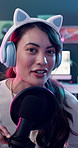 Face, microphone and podcast with influencer in headphones for content creation or broadcasting. Bunny ears, live streaming and talk show with happy woman host in studio for subscription service
