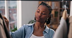 Black woman, clothes and thinking for small business, sale and creative fashion boutique with choice. Designer, inventory and wardrobe for startup store, retail service or decision with product rail