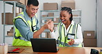 High five, laptop and logistics with people in warehouse for shipping deal, delivery confirmation and profit. Success, ecommerce increase and team with man and woman in factory for partnership