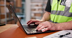 Typing, hands and worker in logistics with laptop for inventory management, dispatch or planning. Keyboard, person and man in distribution center with tech for supply chain, shipping order or review.