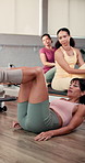 Women, fitness and instructor in gym, exercise and challenge with wellness, workout and training. Showing technique, personal trainer and people in health club, endurance and support with routine