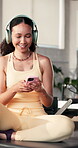 Fitness, smartphone and woman with headphones, gym and listening to music with app, happy or athlete. Healthy, African person and streaming playlist with tech, break and browsing on mobile for song