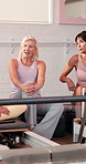Relax, pilates and discussion with women in studio for personal trainer, fitness advice and bonding. Reformer machine, wellness and yoga class with group of friends for workout, support and health