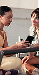 Woman, friends and phone at pilates club with smile, break or research with fitness coach on reformer. Personal trainer, girl and smartphone with mobile app, advice and discussion at wellness class