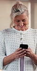 Mature woman, phone and laugh at pilates class with funny meme, gossip or notification on web. Person, smartphone and scroll with comic video, chat and post on app with social media at fitness club