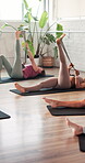Pilates class, fitness and woman with resistance band in studio, stretching legs or core training. Workout session, flexibility challenge and people in health club to exercise, high angle or wellness