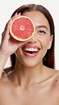 Happy woman, face and grapefruit for skincare in studio, natural glow and pride on white background. Person, model and citrus product with confidence, beauty and vitamin c with smile in Colombia