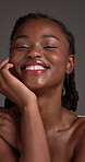Beauty, face and laughing with black woman in studio for dermatology results or satisfaction. Cosmetics, funny and skincare with happy African model on gray background for glow, self care or wellness