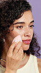 Beauty, makeup and woman with sponge, studio and foundation application with equipment or self care. Background, confident and person with blender for cosmetics, wellness and product for healthy skin