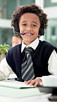 Playing, call center and face of child in office for consultant, contact and virtual assistance. Pretend, business and portrait of boy with headset for customer service, online support or help
