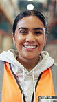 Happy, woman and logistics in factory, face and confident for stock distribution, export or shipping. Laughing, engineer and person with smile for supply chain, storage and commerce in warehouse