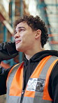 Phone call, distribution and man in warehouse, talking and logistics with communication. Person, smartphone and employee in factory, conversation and feedback for inspection, manufacturing and export