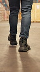 Legs, person and walking for logistics at warehouse for inspection, quality control and supply chain. Shoes, man or storage for stock check, inventory management and supervisor for cargo distribution