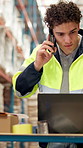 Laptop, phone call and problem solving with man in warehouse for delivery or logistics management. Communication, computer and documents with employee in factory for distribution, stock or storage