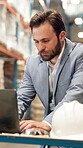 Man, manager and laptop for logistics at warehouse for research, supply chain and schedule shipping. Male person, typing and pc for inventory management, review information and distribution industry