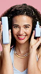 Face, serum and skincare with woman in studio for advertising or marketing of cosmetic product. Beauty, bottle and recommendation with smile of happy person on pink background for dermatology advice