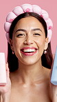 Face, makeup and skincare with woman in studio for advertising or marketing of cosmetic product. Beauty, recommendation an serum with smile of happy person on pink background for dermatology advice