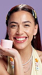 Face, happy woman or beauty in studio with cream, skincare cosmetic or dermatology for wellness. Person, lotion or moisturizer for healthy skin, collagen and anti aging benefits on purple background.