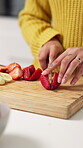 Hands, woman and cutting fruit at house with healthy snack, meal prep and breakfast wellness. Female person, organic and chopping ingredients for vegan salad, nutrition brunch and digestion benefits