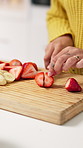 Morning, strawberry and hands of woman in kitchen for healthy meal for detox, diet and nutrition. Home, breakfast and person with fruit, organic food and snack for wellness, vitamins and weight loss