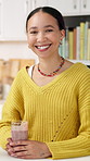 Happy, kitchen and face of woman with smoothie for wellness, healthy diet and detox with vitamins. Breakfast, home and portrait of person with drink for nutrition, organic supplements and weight loss