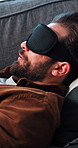 Mental health, man or talk on couch with blindfold for sensory awareness, healing trauma or counseling. Psychology, person or speaking on sofa with sleep mask for somatic therapy, help or evaluation.