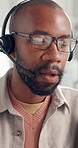 Call center, headset and black man in office, glasses and communication with feedback. Questions, reflection and African person with eyewear, discussion and customer service with advice and help desk