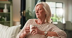 Home, thinking and old woman on sofa, coffee and memory with break, relax and caffeine in living room. Wonder, pensioner or senior person on couch, herbal tea or nostalgia with reflection or remember