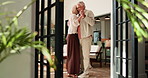 Romance, senior couple and dance in home for anniversary celebration, holding hands and spin. Retirement, man and woman moving to music in living room for love, connection and happiness with embrace