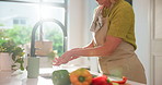 Washing hands, soap and faucet at kitchen sink with hygiene, food and vegetables at home. Person, drops and rinse for germs with organic ingredients, preparation or cooking with flare at apartment