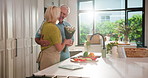 Cooking, old couple or surprise with flowers in home for anniversary, celebration dinner or hug. Meal prep, senior man and giving bouquet gift to wife in kitchen for romance, love or healthy marriage