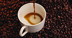 Espresso, beans and above of coffee with cup for caffeine, beverage and hospitality. Roasted product, cappuccino and latte liquid with organic ground drink for blend, cafe production and mocha brew