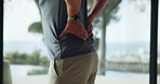 Hands, man and back injury in fitness with muscle tension, workout accident and inflammation in home. Wellness, person and spine fracture in house from herniated disc, joint ache and training sprain
