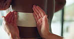 Hands, physiotherapist and plaster on back for injury, recovery and rehabilitation at clinic. Person, physiotherapy and patch for patient with pain, muscle ache or tape for wellness with inflammation