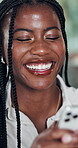 Business woman, laughing and typing with phone in office for funny text, social media post or update. Professional, black person or happy with smartphone for corporate meme, work break or mobile chat