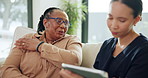 Tablet, nurse or elderly woman with shoulder pain in retirement home with consultation, checkup or chat. Conversation, senior person and caregiver with tech for wellness, health update and support.