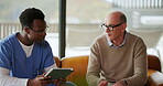 Nurse, mature man and conversation with tablet on sofa for healthcare, communication or consultation in home. Caregiver, advice and talking to senior person for help, support and medical results