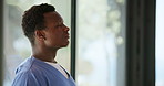 Doctor, sad and black man in hospital thinking of surgery mistake, fail and loss by window. Healthcare, clinic and person with stress, worry and overwhelmed for medical service, crisis and burnout