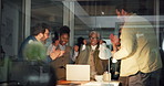 Woman, team and celebration in office meeting at startup for success, laptop and night at media company. Editor, group and people with applause, high five or achievement with goals at creative agency