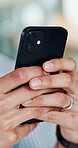 Business, person and hands with phone in office for email response, texting client or schedule update. Professional, employee and closeup with smartphone for online networking, work break or research