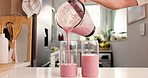 Pour, blender and smoothie with hands of person in kitchen for diet, detox and nutrition. Antioxidants, gut health and weight loss with man and drink in home for protein shake, fiber and vitamins