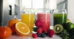 Nutrition, fruit and glass of juice in kitchen for detox, antioxidants and vegan drink. Wellness, health and vegetables with organic liquid on table top of home for diet, breakfast and weight loss
