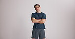 Fitness, face or athlete in studio with arms crossed, sportswear or progress goal in performance. Space, muscle or man on white background with confidence, challenge or health for body transformation