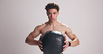 Fitness, face and athlete squat with medicine ball in studio for endurance training, workout and resilience. Equipment, portrait and man with strength exercise, crossfit and space on white background