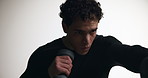 Athlete, man and boxing with dumbbell in studio for bicep training, fitness and exercise. Male person, bodybuilder and equipment for workout, sports challenge and strong muscle on white background