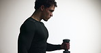 Athlete, man and exercise with dumbbell in studio for bicep training, fitness and performance. Male person, power and equipment for workout, sports challenge and strong muscle on white background