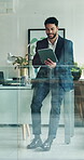 Man, smile and scroll on tablet for business, green NGO or project management at desk. Sustainable company, employee or tech in glass office for website update, research or engaging on platform