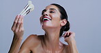 Laughing, woman and makeup brush in studio, beauty and pride with tool, smile and purple background. Mockup space, happiness and mature person with equipment for foundation application and cosmetics