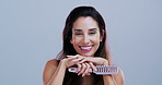 Brush, hair and face of happy woman in studio for grooming, growth or healthy texture. Salon, mockup space and portrait of mature person with haircare tools for volume or wellness on white background